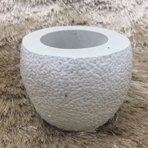 Plaster cast orange fruit planter